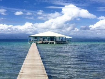 Long wooden dock leading out to Casa Clearwater